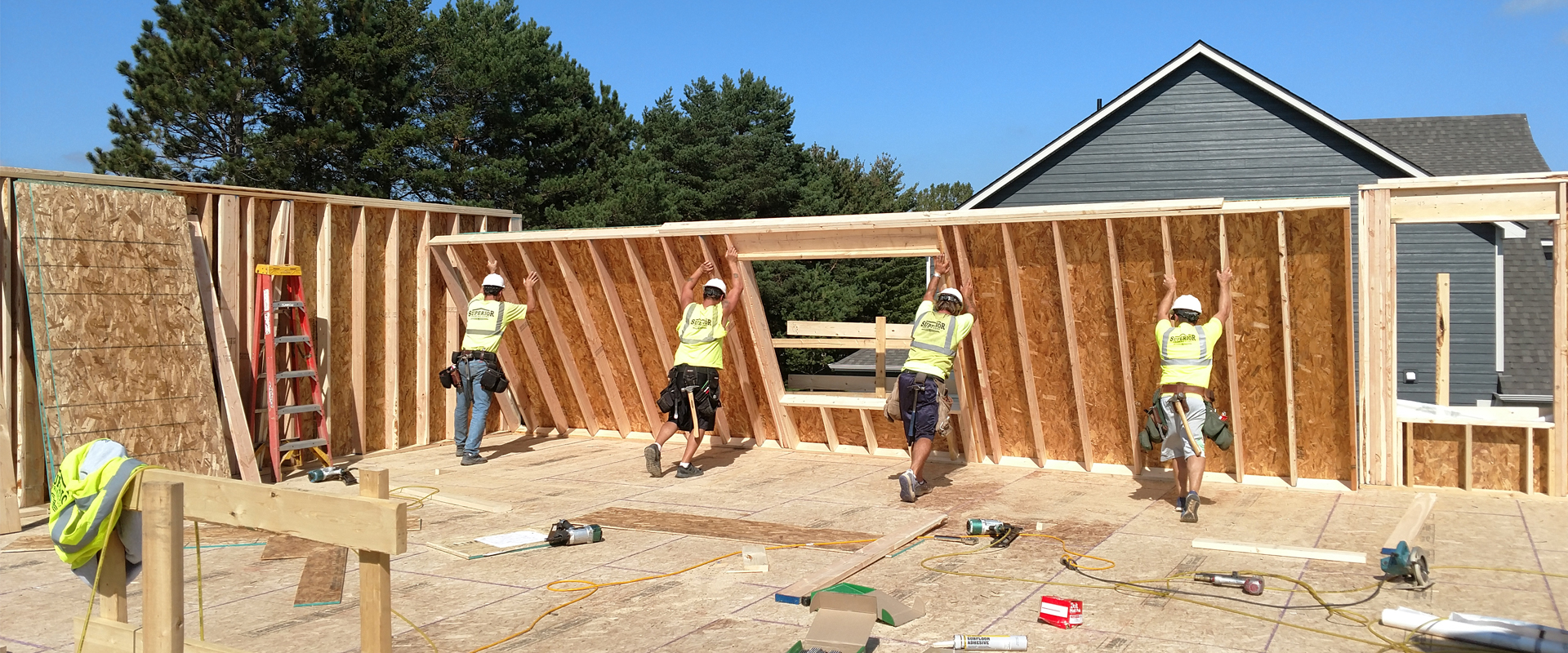 Superior Framing team lifting wall for home frame